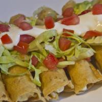 Taquitos Mexicanos · Four stuffed, deep-fried corn tortillas, two chicken and two beef, served with pico de gallo...