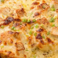 Pollo Gratinado · Grilled chicken chopped with onions served in a sizzling skillet of melted cheese.