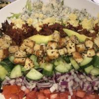 Cobb Salad · Iceberg, baby spinach, cucumbers, red onion, tomato, sliced egg, avocado, bleu cheese crumbl...