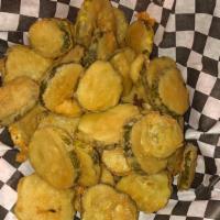 Fried Dill Pickles · Dill pickle chips lightly breaded and fried served with homemade ranch dressing.