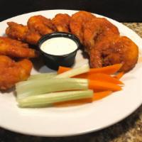 Buffalo Shrimp (12 Shrimp) · Large shrimp soaked in buttermilk, seasoned flour, deep-fried and tossed with your favorite ...