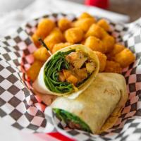 Grilled Chicken Wrap · Grilled chicken tossed in Christopher's sauce, tender fresh baby spinach, diced tomato, and ...