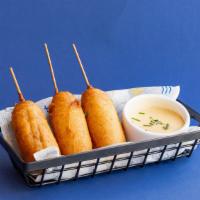 Pancake Corndogs · Sausage links dunked in pancake batter and served with maple aioli.