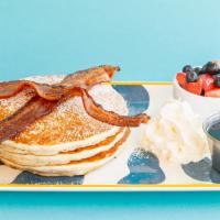 Short Stack Pancakes · With whipped, maple, berries and two pieces of bacon.