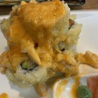 Super Volcano Roll · Spicy tuna, cucumber, avocado, deep fried. Top with baked assorted minced fish in spicy mayo.