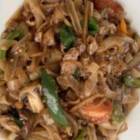 Spicy Basil Noodle (Khee Mao) With Tofu · Spicy stir fried wide noodles with carrots, tomatoes, peppers, onions, bamboo shoots and bas...