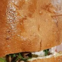 Taqueria Torta · Buttered telera bread, re-fried beans, mayo, sour cream, melted cheese, your choice of prote...