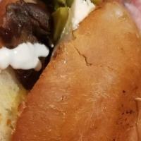 Torta Ranchera · Buttered telera bread, mayo, sour cream, melted cheese. Topped with your choice of steak or ...
