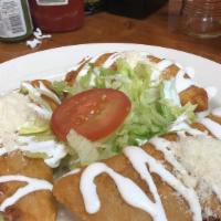 Empanadas · 3 empanadas stuffed with your choice of protein and cheese. Topped with lettuce, tomatoes an...