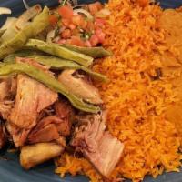 Carnitas · Dos xx infused tender pork, slow fried to a juicy perfection. Served with Mexican rice, refr...
