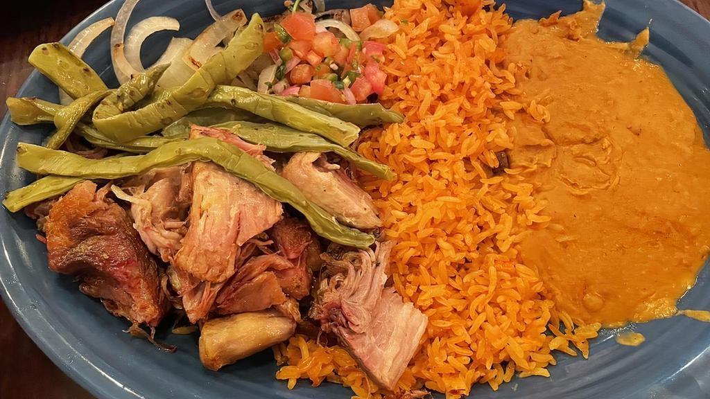 Carnitas · Dos xx infused tender pork, slow fried to a juicy perfection. Served with Mexican rice, refried beans, guacamole, and pico de gallo.