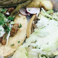 Carne Asada · Skirt steak grilled Mexican style. Served with Mexican rice, refried beans, grilled cactus, ...