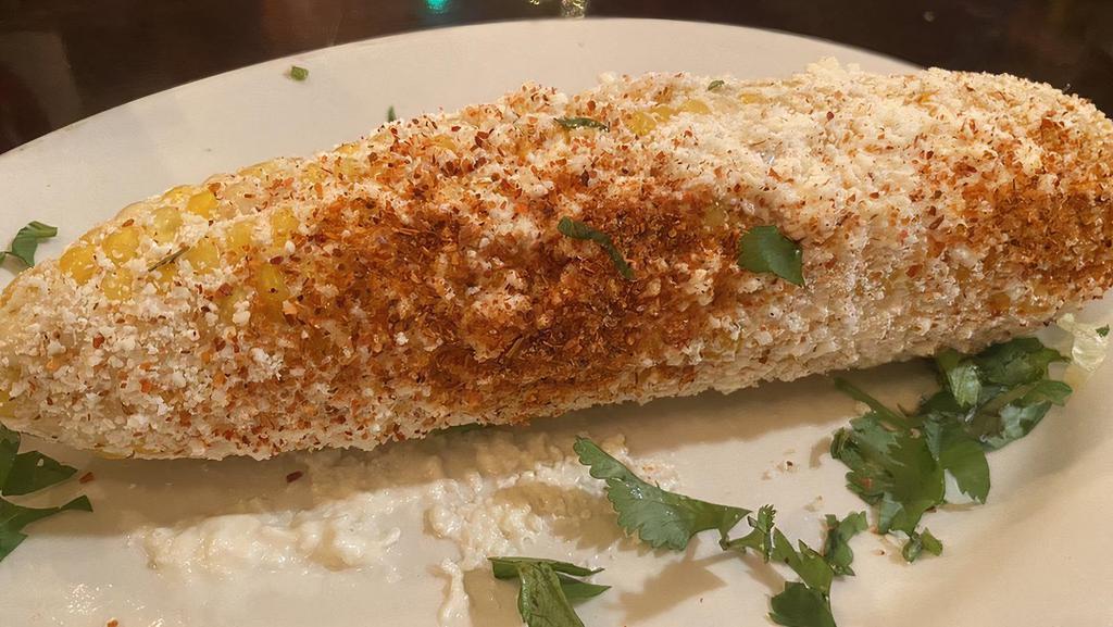 Elote Loco · Street corn. Corn on the cob, mayo, sour cream, cotija cheese and our house chili powder mix.