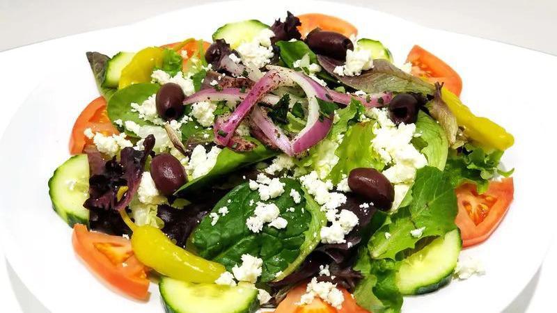 Greek Salad · Fresh greens, tomatoes, cucumbers, red onions, pepperoncini, feta cheese, black olive, and Greek dressing.