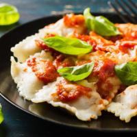 Ravioli · Freshly made ravioli with a choice of filling and topped with marinara sauce and cheese then...