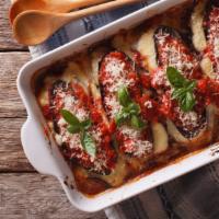 Eggplant Parmesan · Sliced eggplant over spaghetti, topped with marinara served with a side of fresh-baked bread...