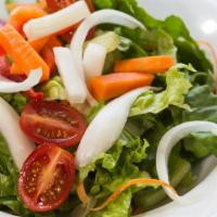 House Salad · Fresh green mixed lettuce tossed with tomatoes, black olives, red onions, bell peppers, and ...
