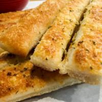 Breadsticks · Eight pieces of fresh-baked breadsticks covered with parmesan cheese, olive oil, basil, and ...