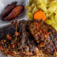 Jerk Chicken · Tender chicken marinated in authentic jerk seasonings and smoked over pimento wood, served w...