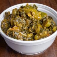 Calaloo · Jamaican spinach with spices, onions, and peppers.