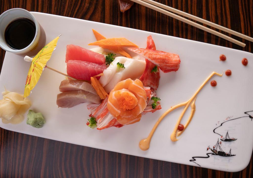 Sushi & Sashimi · Six pieces chef's choice sushi, eight pieces chef's choice assorted sashimi, one California roll, and tuna roll