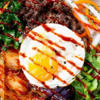 Seoul · Bulgogi beef, kale mix, kimchi, pickled carrots, romaine lettuce, eggplant, fried gg, scalli...