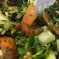 Tabbouleh (V) · Finely chopped parsley, tomato, cucumber & onion tossed in our olive oil & lemon dressing