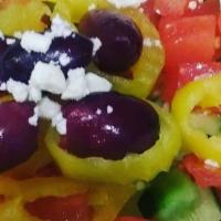 Greek Salad (V) · Lettuce with diced tomato, cucumber, banana peppers, kalamata olives & feta cheese with our ...