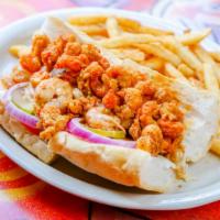 Fried Shrimp Po - Boy · Most popular. Served with french fries and dressed with coleslaw, tomato, pickles, onions, a...