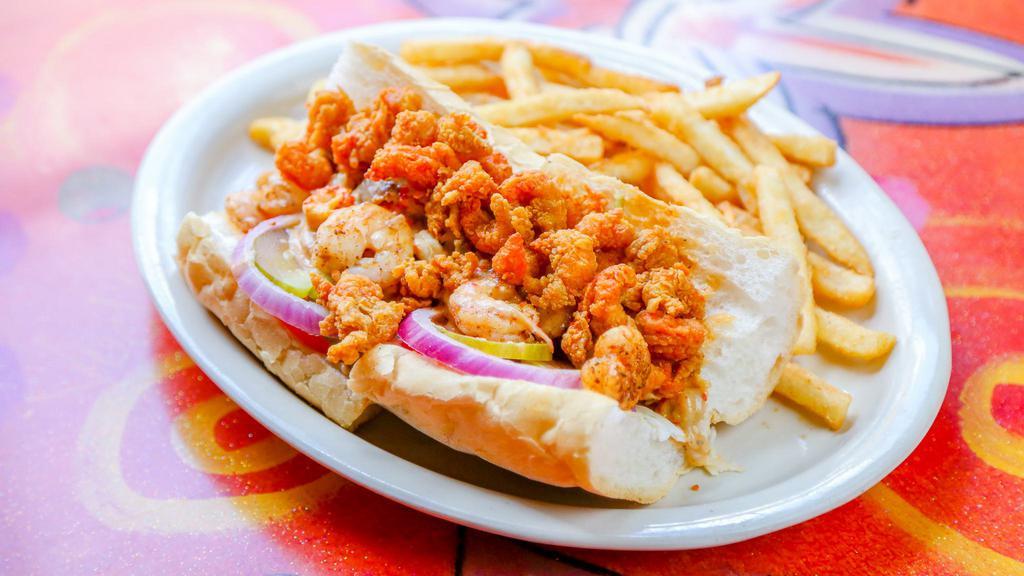 Fried Shrimp Po - Boy · Most popular. Served with french fries and dressed with coleslaw, tomato, pickles, onions, and remoulade.