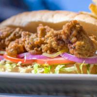 Fried Louisiana Oyster Po - Boy · Served with french fries and dressed with coleslaw, tomato, pickles, onions, and remoulade.