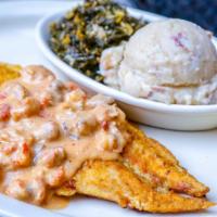Redfish Cookery · Sauteed redfish topped with our own crawfish mushroom cream sauce. Served with roasted garli...