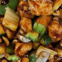 C 5. Kong Pao Chicken · Spicy .Stir-Fried with Red & Green Peppers, Fresh Squash & Peanuts in A Sweet & Spicy Red Sa...
