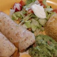 Chimichangas · Choice of 2. Chicken, ground beef or veggie served with rice, salad and a side of guacamole.