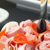 Chef'S Salad · Sliced turkey breast and ham. Tossed over crisp lettuce with tomatoes, black olives, cucumbe...