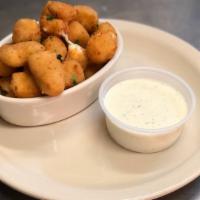 Cheese Curds · Lightly battered Wisconsin cheese served with ranch and marinara dipping sauce.
