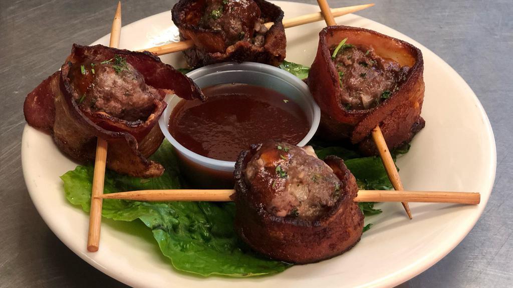 Hog Balls · Four pepperjack cheese and onion stuffed meatballs, wrapped in bacon and served with a side of BBQ sauce.