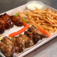 Traditional Wings · Tossed in your choice of sauce. With carrots, celery and dipping sauce.