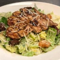 Chicken Caesar Salad · Romaine topped with grilled chicken, parmesan cheese, croutons and Caesar dressing.