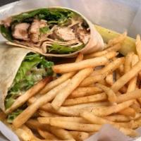 Chicken Caesar Wrap · Romaine topped with grilled chicken, parmesan cheese,  and Caesar dressing. Wrapped in a flo...