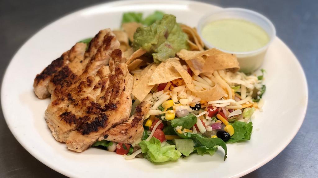 Southwest Salad · Romaine topped with your choice of chicken or steak, black bean and corn relish, pico, cheese, tortilla strips, and guacamole.