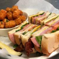 Club Sandwich · Turkey, ham and bacon with cheddar cheese, lettuce, tomato, mustard, and mayo on toasted cou...