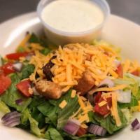 Side Salad · Lettuce topped with cheese, tomato, onion and croutons with choice of dressing.