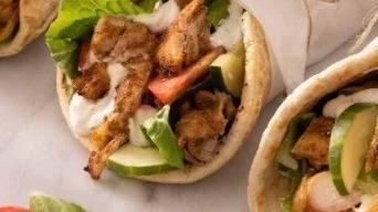 Shawarma · Chicken or beef. Served with salad, hummus, and pita bread.