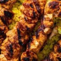 Chicken Tikka · Skinless half chicken marinated then grilled to perfection. Served with salad, hummus, and p...
