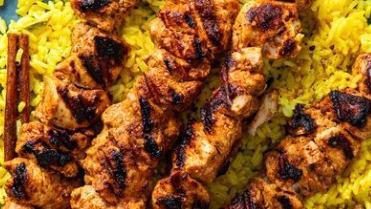 Chicken Tikka · Skinless half chicken marinated then grilled to perfection. Served with salad, hummus, and pita bread.