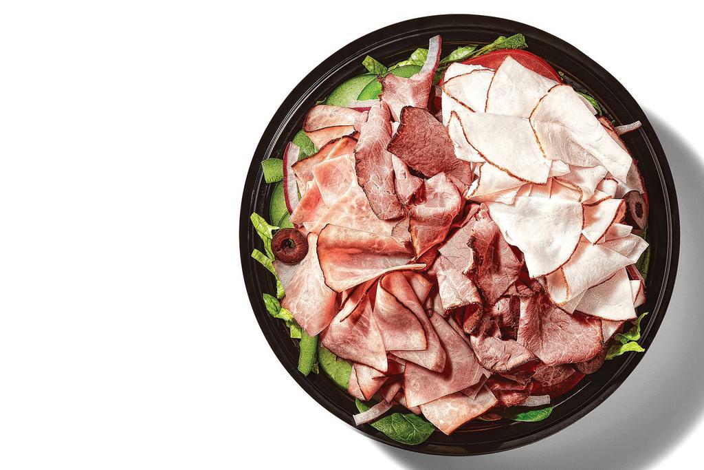 Subway Club® · One bowl, THREE proteins: Oven-Roasted Turkey, Black Forest Ham, and Choice Angus Roast Beef are stacked on fresh, crisp veggies.