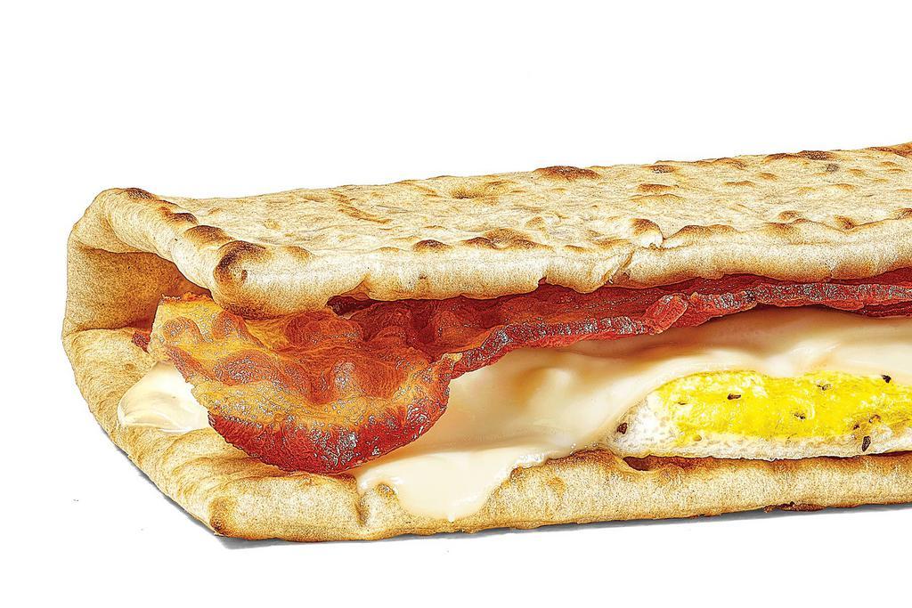 Bacon, Egg & Cheese · Start your day in a sizzlin' way with  bacon, egg, and melty cheese on freshly toasted flatbread (or whatever you like). Pile on your favorite veggies and sauce. Start the day right.