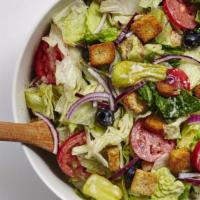 Garden Salad · A crisp medley of fresh greens, red cabbage, cucumbers, tomatoes, carrots, Cheddar cheese, a...