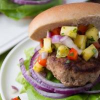 Jerk Burger · Grilled juicy ground beef patty flavored with Jerk seasonings, topped with avocado, and Swis...